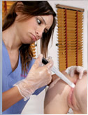 Amber inserts the anal probe